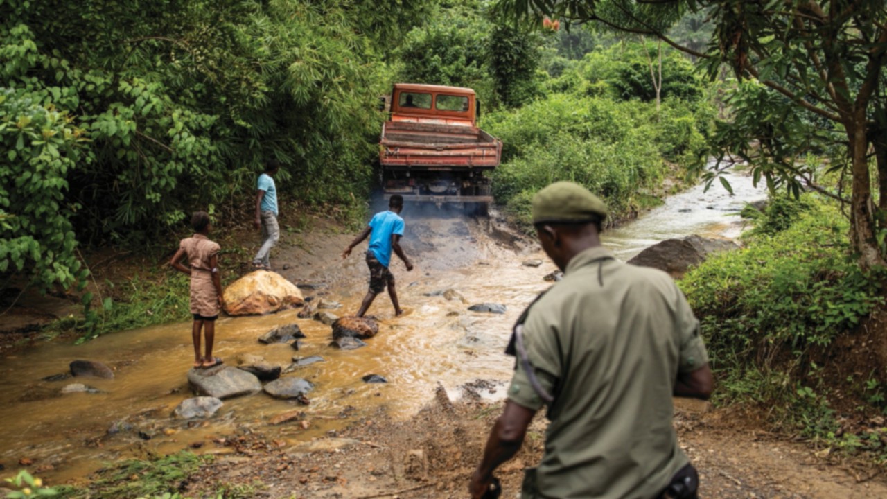 A National Protected Area Authority (NPAA) forest ranger starts his daily patrol into Kambui Hills ...